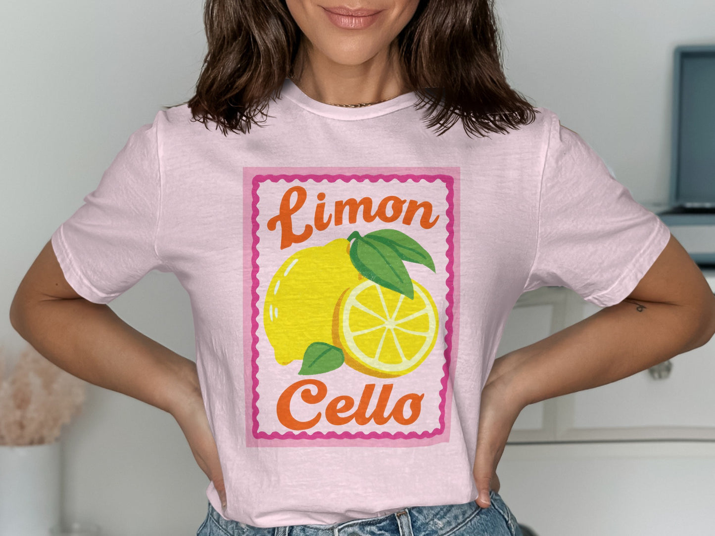 Pink t-shirt with a "Limoncello" graphic featuring lemons and leaves.