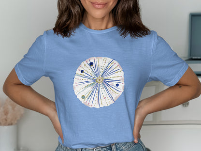 Light blue t-shirt with a stylized sea urchin graphic.