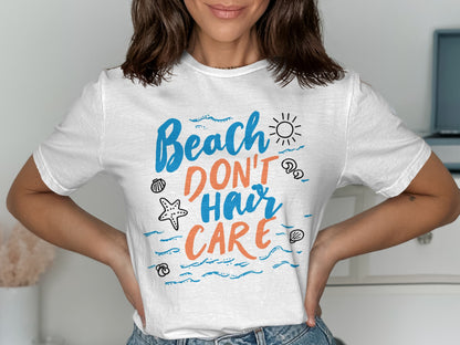 White t-shirt with "Beach Don't Hair Care" text and beach-themed doodles.