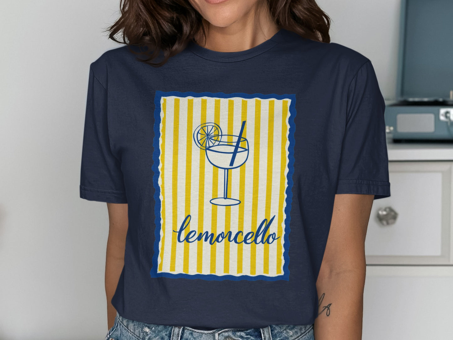 Navy blue t-shirt with limoncello glass graphic and yellow striped background.