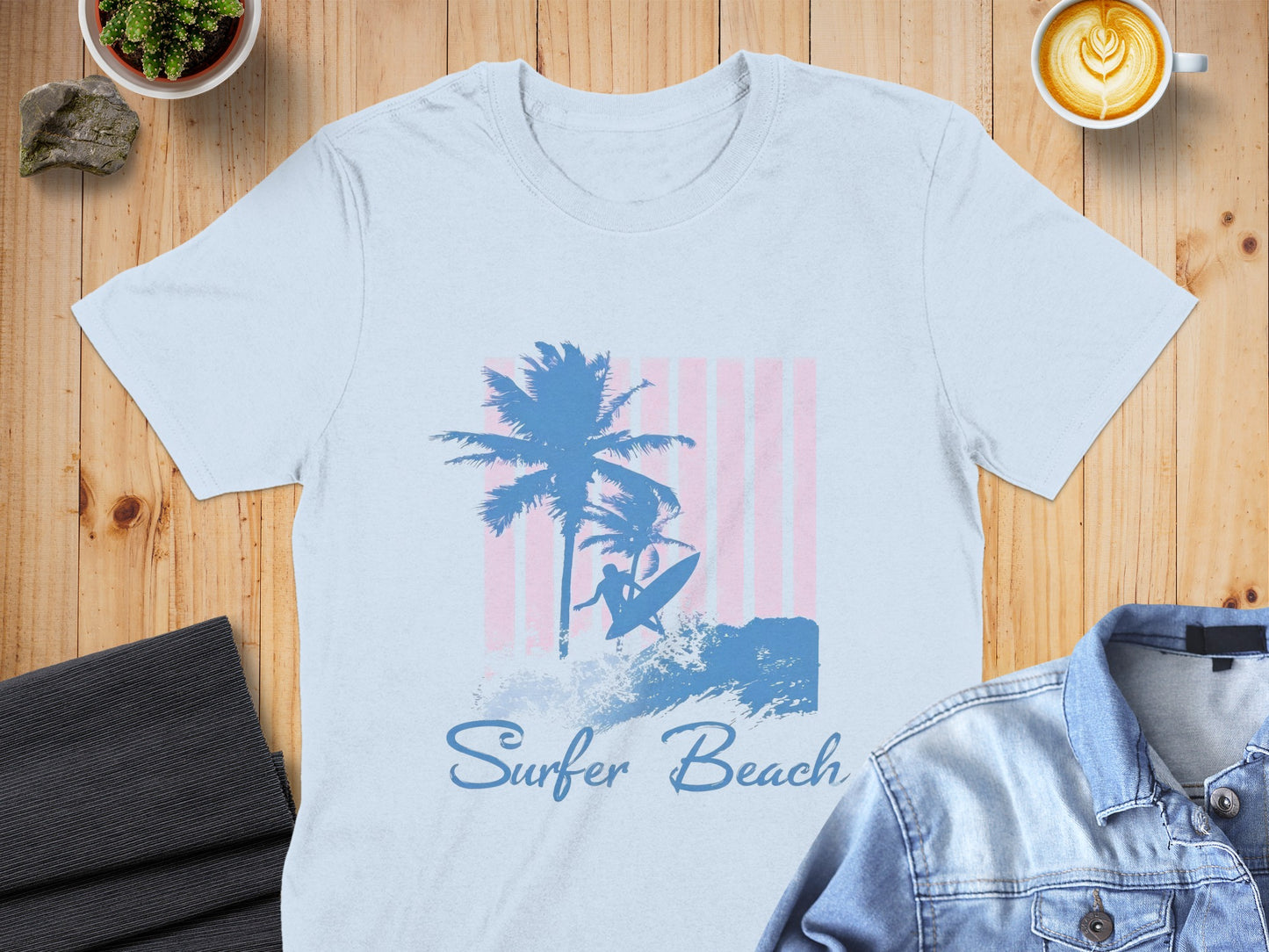 Light blue t-shirt with "Surfer Beach" and a palm tree and surfer graphic.