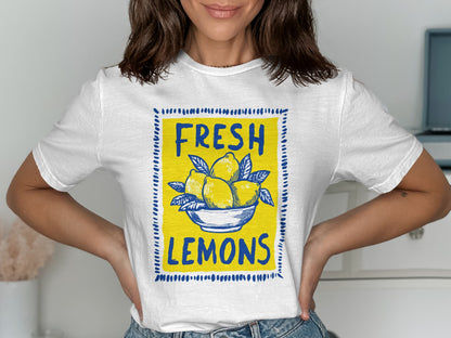 White t-shirt with a yellow bowl of lemons and "FRESH LEMONS" text.