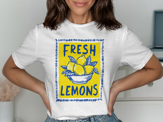 White t-shirt with a yellow bowl of lemons and "FRESH LEMONS" text.