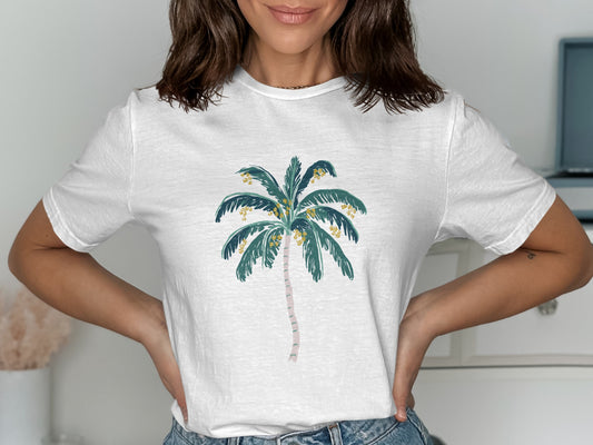 White t-shirt with a graphic of a stylized palm tree.