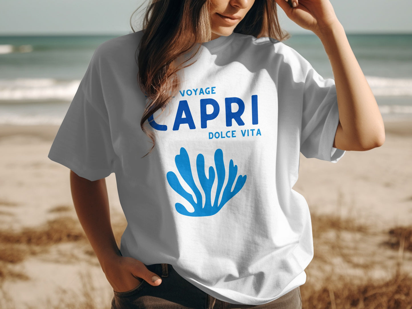 White t-shirt with "VOGAGE CAPRI DOLCE VITA" and blue coral graphic.