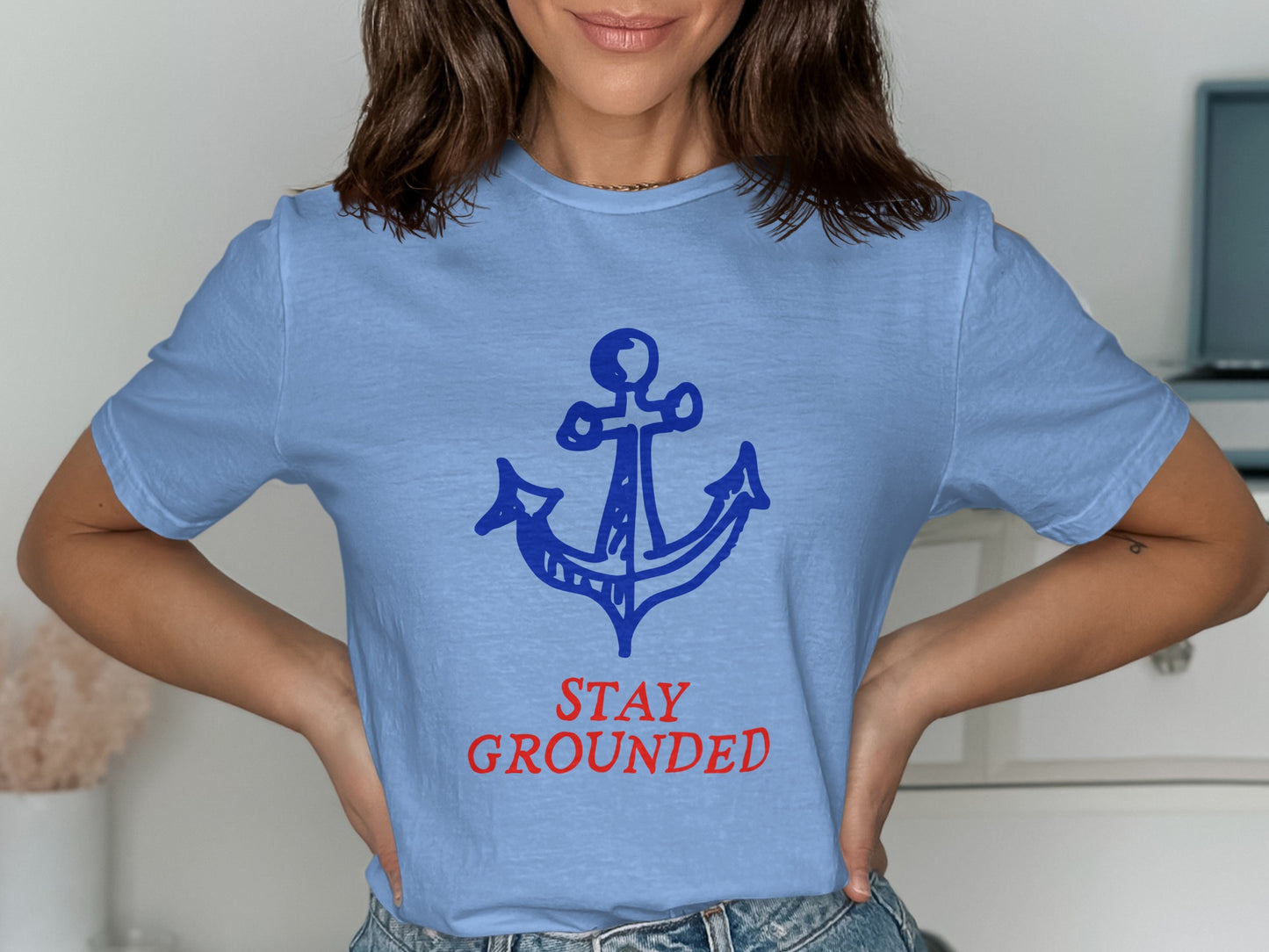 Light blue t-shirt with blue anchor and "STAY GROUNDED" text.