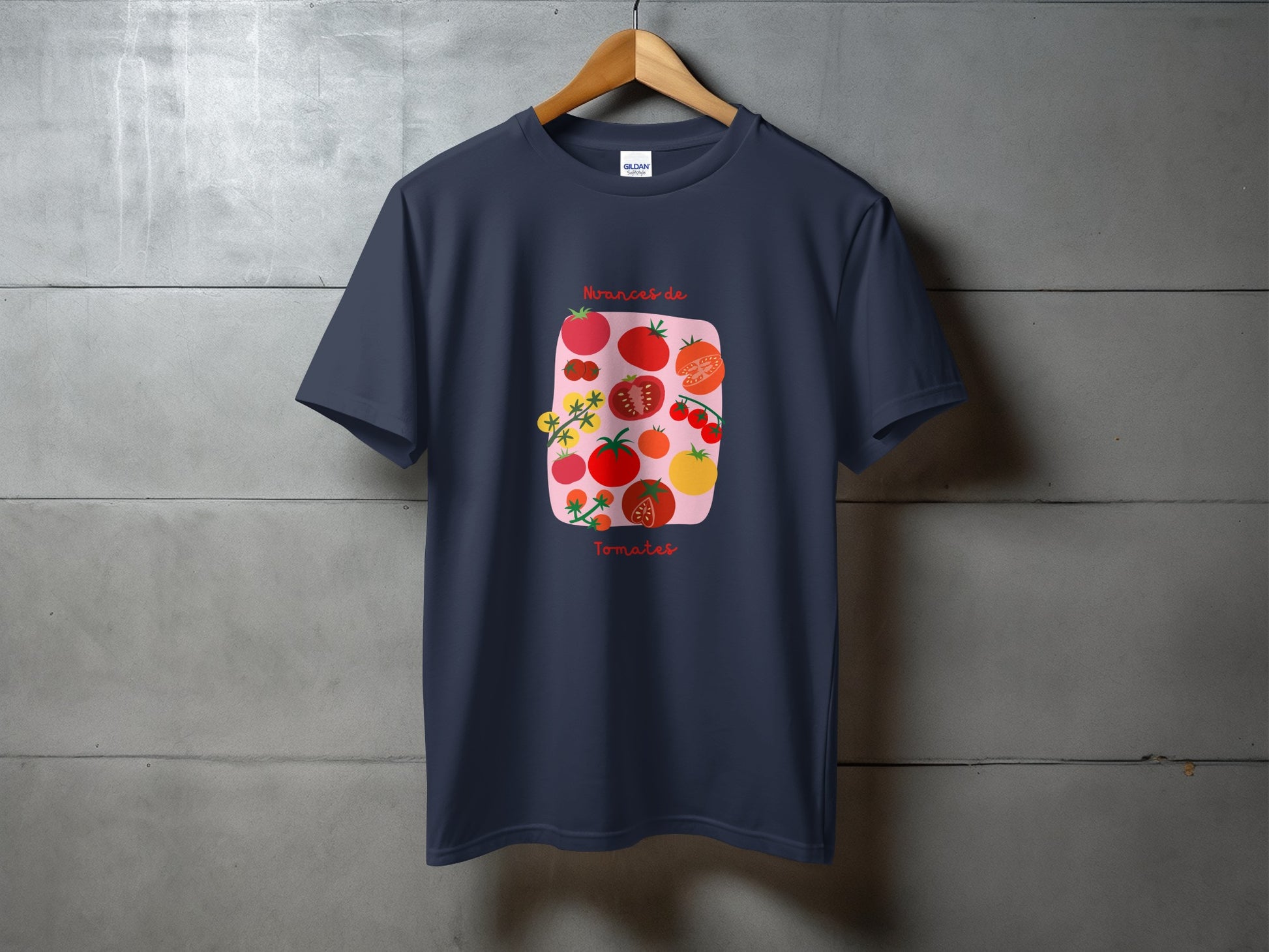 Dark navy t-shirt with illustration of red and yellow tomatoes and flowers.
