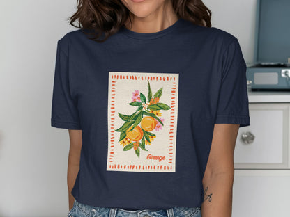 Navy t-shirt with "Orange" text and illustrated oranges, leaves, and flowers.