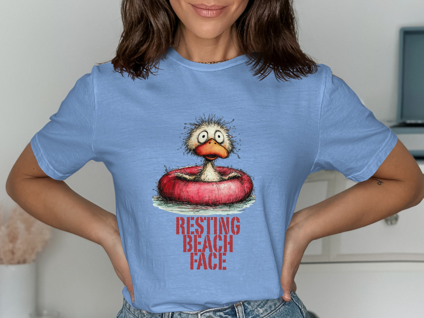 Duck with worried expression in inflatable ring, "RESTING BEACH FACE" text.
