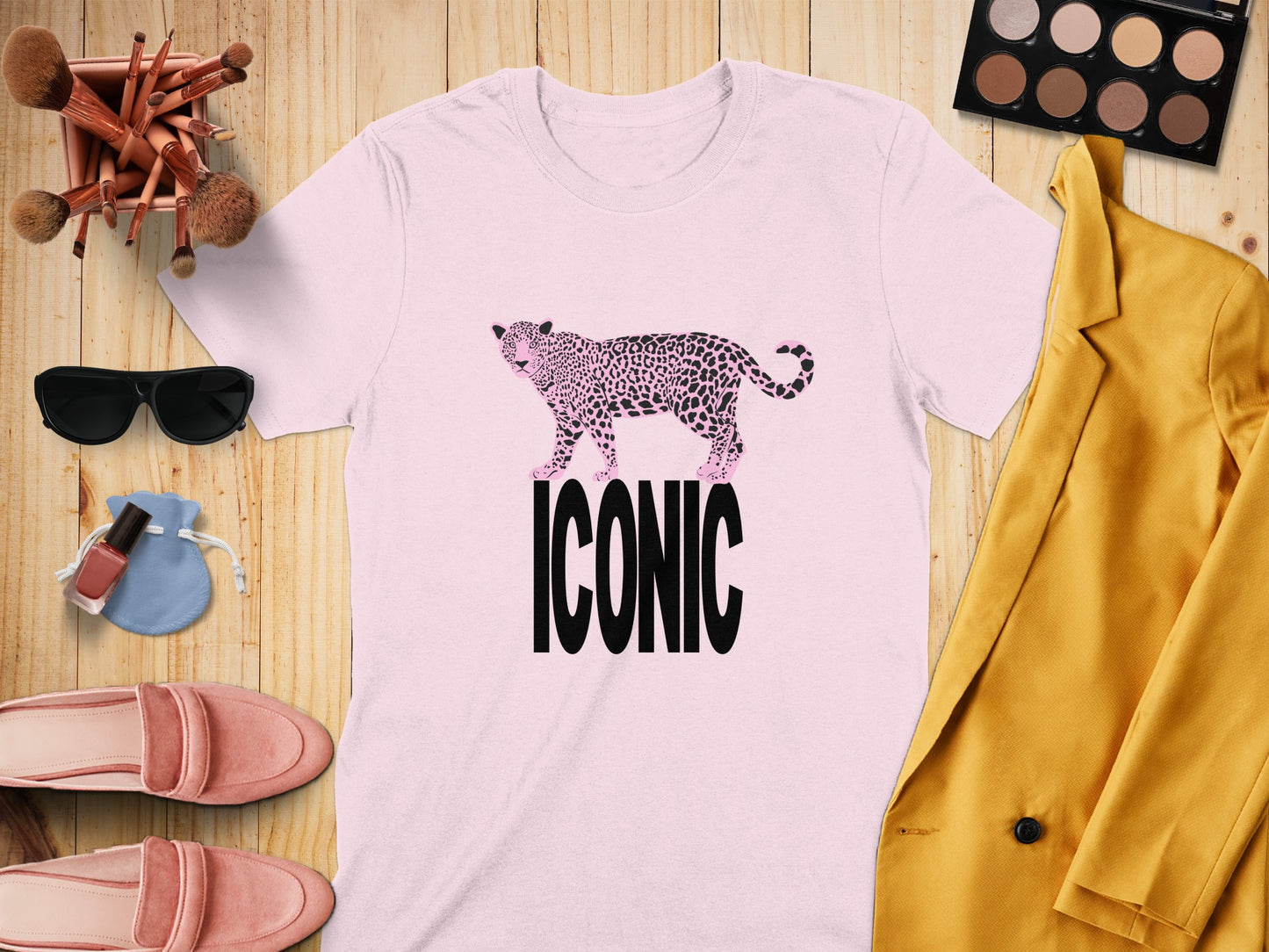 Pink t-shirt with leopard print cheetah graphic and "ICONIC" text.