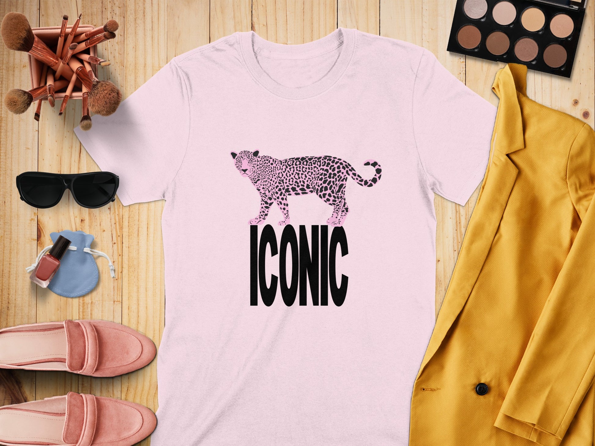 Pink t-shirt with leopard print cheetah graphic and "ICONIC" text.
