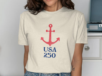 Cream t-shirt with red anchor and blue "USA 250" text.