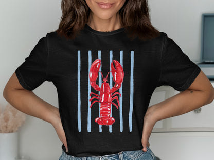 Black t-shirt with a red lobster on blue vertical stripes.