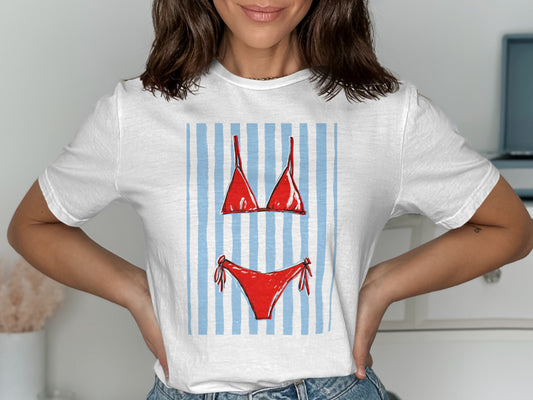 Red bikini top and bottom on a white t-shirt with blue stripes.