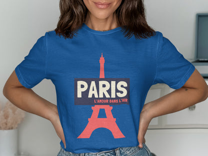 Blue t-shirt with "PARIS L'AMOUR DANS L'AIR" and Eiffel Tower graphic.