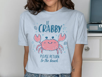 Light blue t-shirt with a smiling cartoon crab and text "IF CRABBY PLEASE RETURN to the beach".