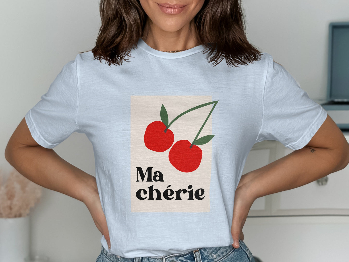 White t-shirt with "Ma Chérie" text and two red cherries.
