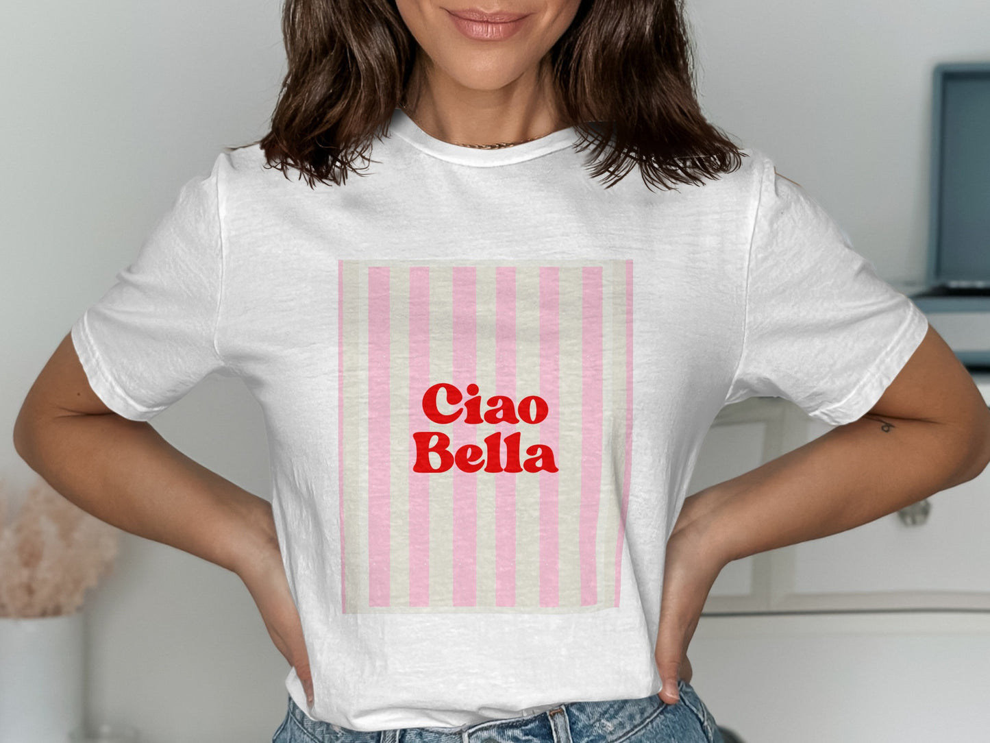 White t-shirt with "Ciao Bella" in red on pink and white stripes.