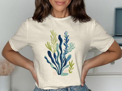 Cream t-shirt with abstract blue and green botanical print.