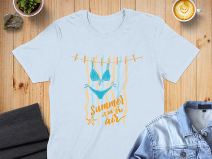 Light blue bikini drying on a clothesline with "Summer is in the air" text.