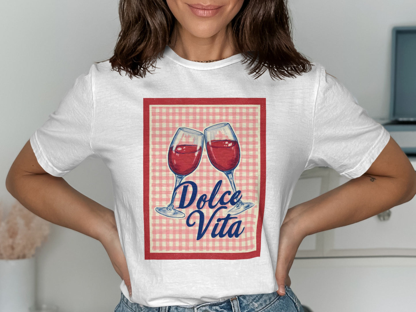 White t-shirt with two glasses of red wine and "Dolce Vita" text.