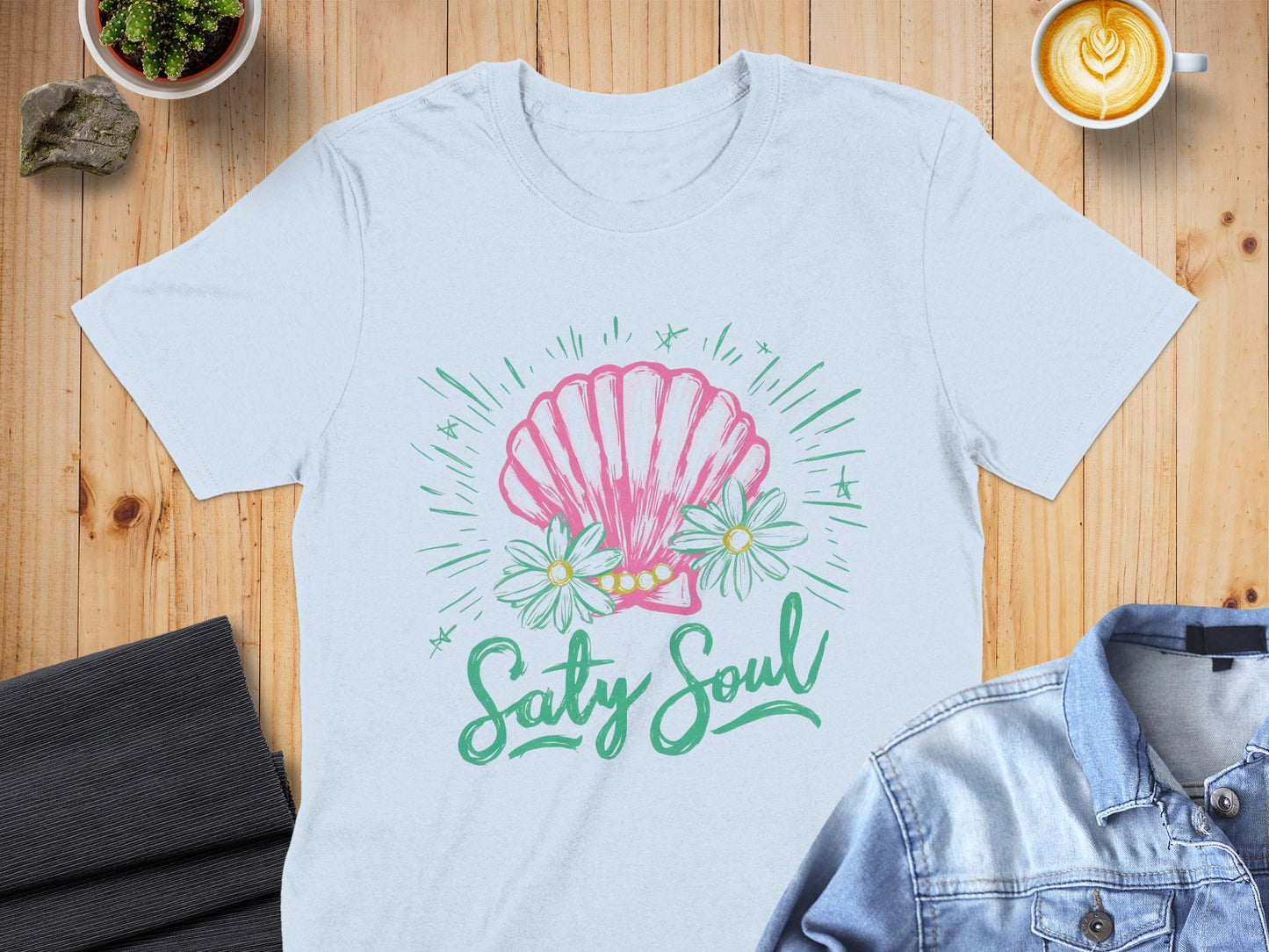 White t-shirt with pink seashell, daisies, and "Salty Soul" text.
