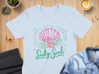 White t-shirt with pink seashell, daisies, and "Salty Soul" text.
