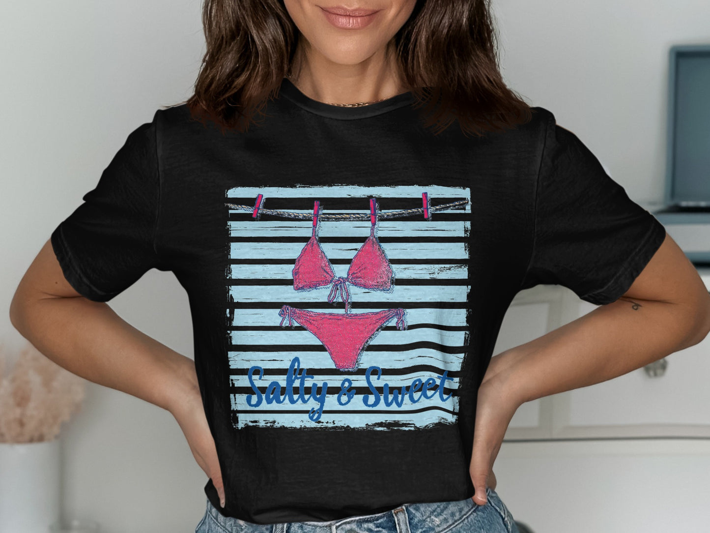 Pink bikini hanging on clothesline with "Salty & Sweet" text.