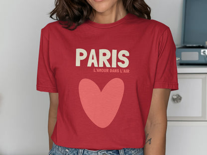 Red t-shirt with "PARIS L'AMOUR DANS L'AIR" and a large pink heart.