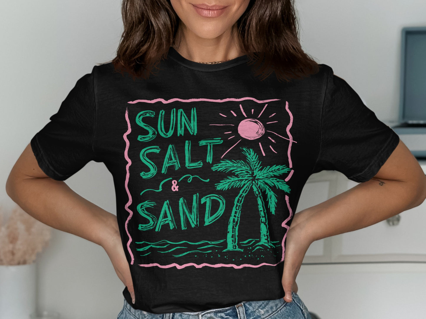 Black t-shirt with "Sun Salt & Sand" text and palm tree graphic.
