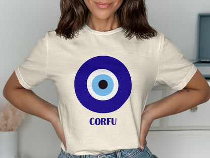 Cream t-shirt with blue and white evil eye graphic and "CORFU" text.