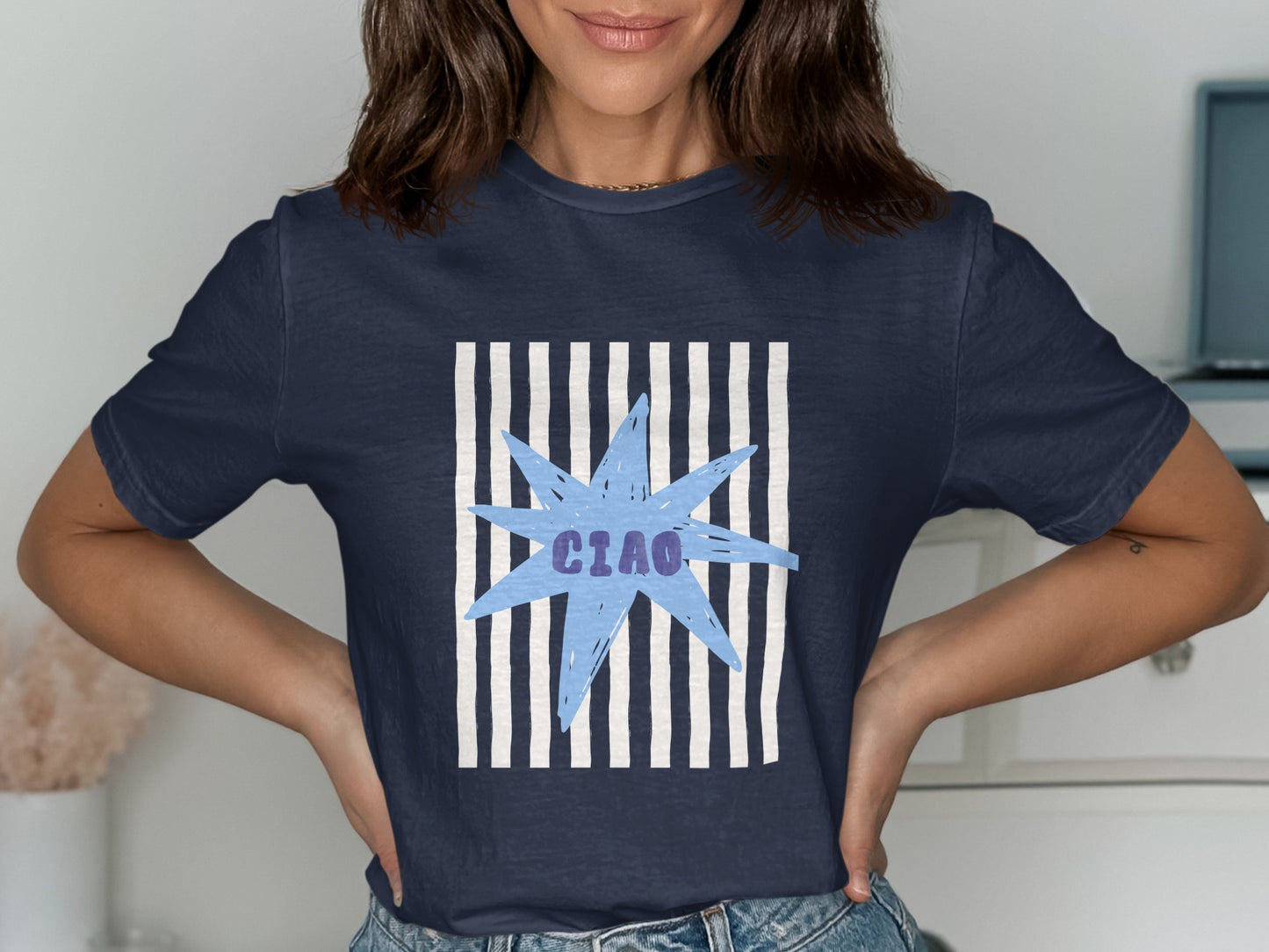 Navy t-shirt with a light blue starburst and "CIAO" text.