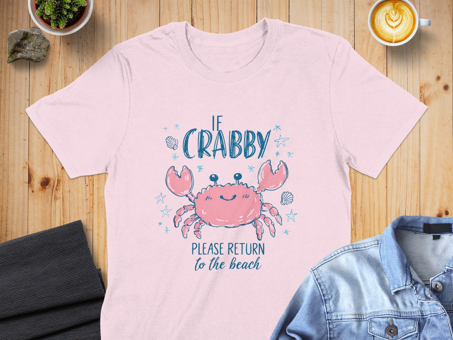 Pink t-shirt with graphic of a crab and text "If Crabby, Please Return to the Beach".