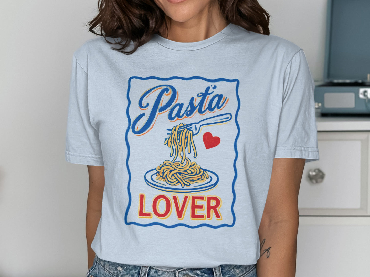 Light blue t-shirt with "Pasta Lover" and spaghetti on a fork.