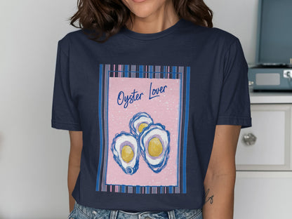 T-shirt with three oysters on a pink background, text "Oyster Lover".