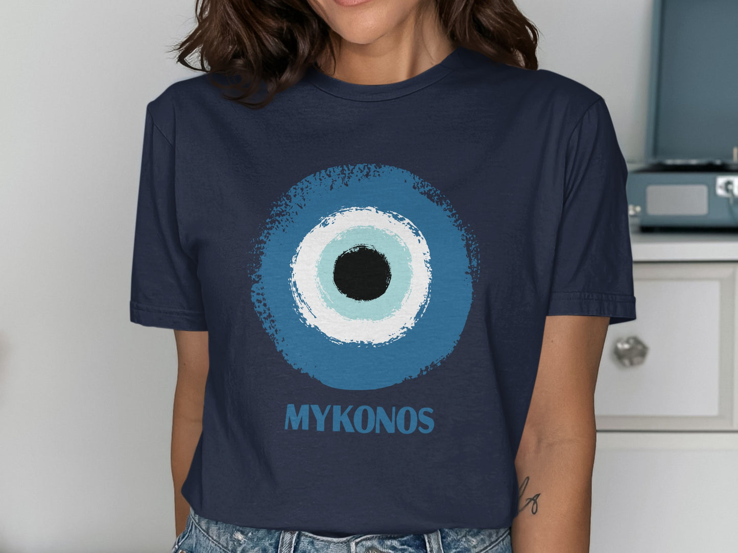 Navy t-shirt with blue and white concentric circles and the word "Mykonos".