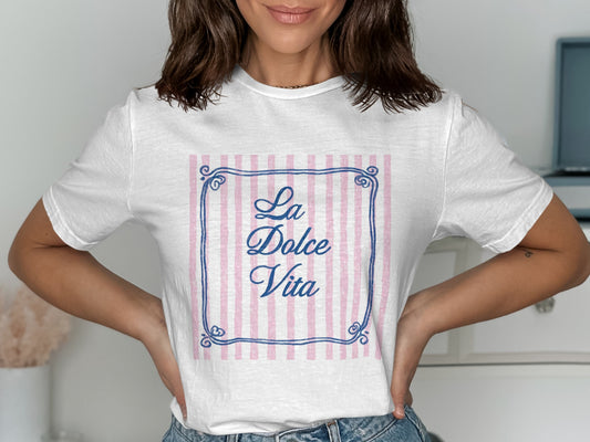 White t-shirt with pink and white striped frame and "La Dolce Vita" text.