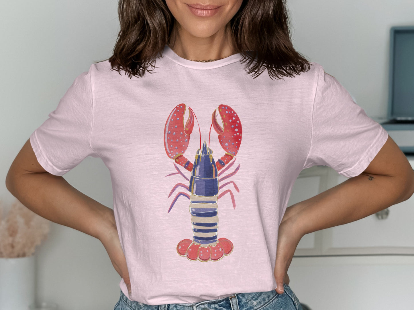 Pink t-shirt with a graphic of a blue and purple lobster with red claws.