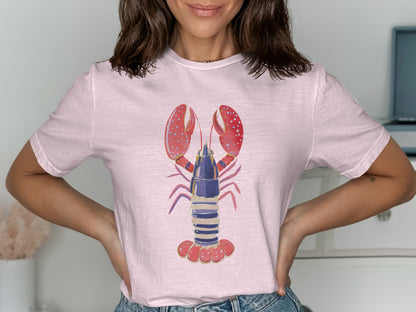 Pink t-shirt with a graphic of a blue and purple lobster with red claws.