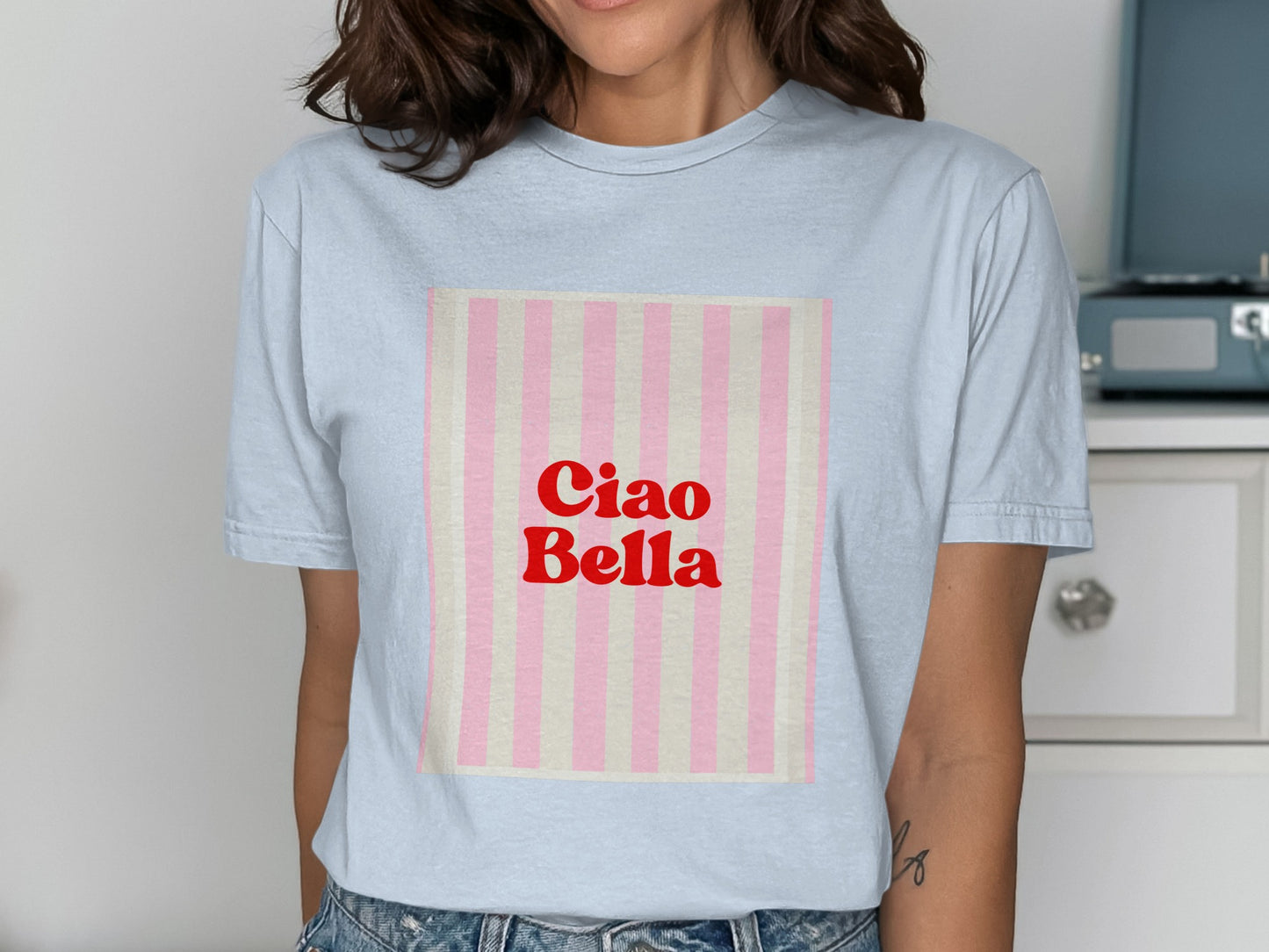 Light blue t-shirt with pink and white vertical stripes and "Ciao Bella" text.