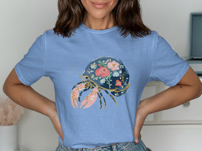 Blue t-shirt with a floral hermit crab design.