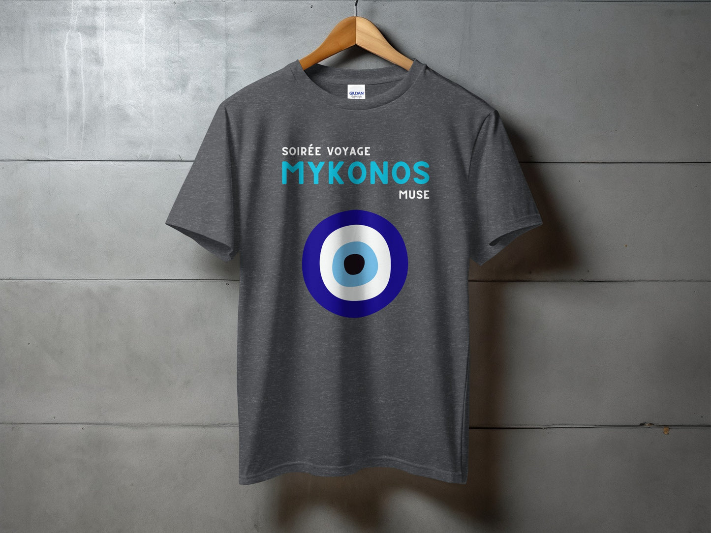 Dark grey t-shirt with "SOIRÉE VOYAGE MYKONOS MUSE" and a blue and white evil eye symbol.