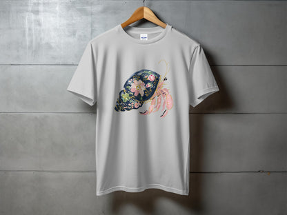 White t-shirt with a seashell and hermit crab graphic.