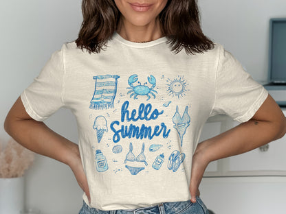 Light blue t-shirt with hand-drawn beach icons and "Hello Summer" text.