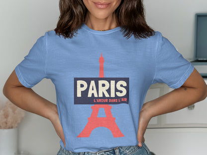Light blue t-shirt with "PARIS L'AMOUR DANS L'AIR" and Eiffel Tower graphic.