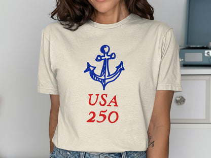 Cream t-shirt with a navy anchor and "USA 250" text.