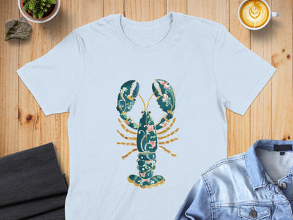 Light blue t-shirt with ornate green and pink lobster graphic.