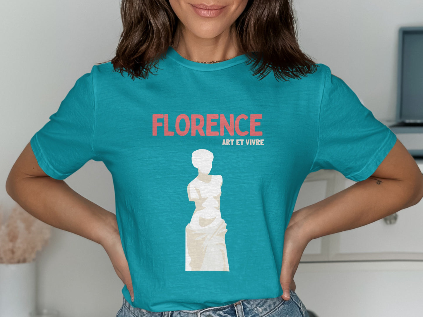 Teal t-shirt featuring "Florence Art et Vivre" text and a white statue outline.