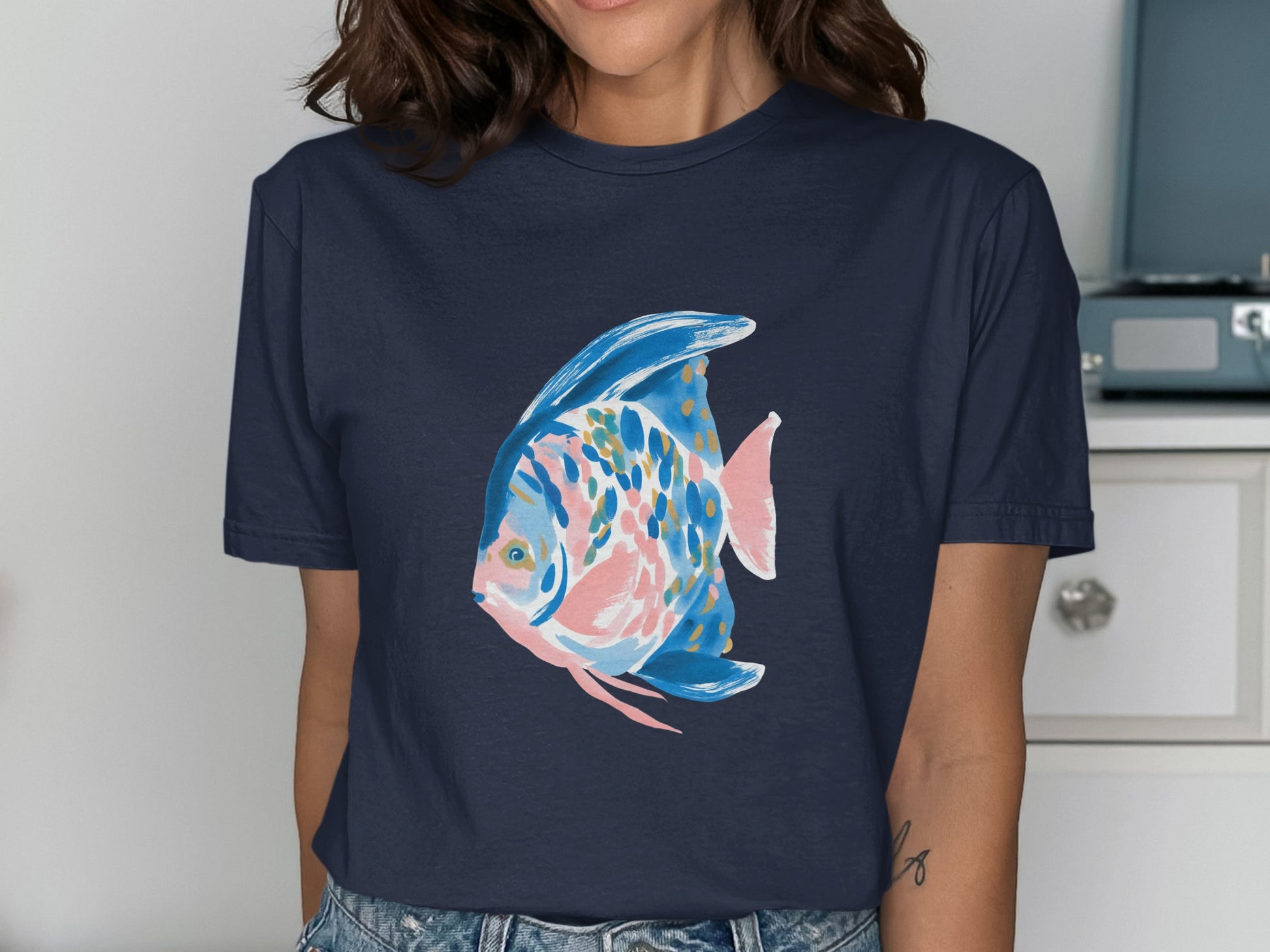 Navy blue t-shirt with a colorful abstract fish graphic.