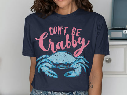 Navy t-shirt with pink text "DON'T BE Crabby" above a blue crab.